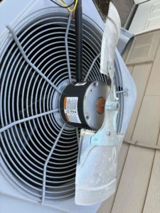 Eugene HVAC repair technician correcting a condensate drain issue affecting air conditioning performance
