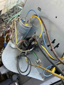 Eugene AC repair technician diagnosing unusual noise during an air conditioner repair service