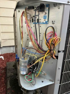 Eugene HVAC repair technician testing cooling performance after completing AC repairs